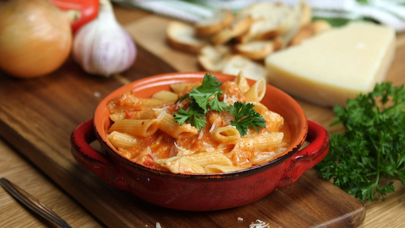 penne pasta swimming in saucy high protein tomato basil pasta sauce base 
