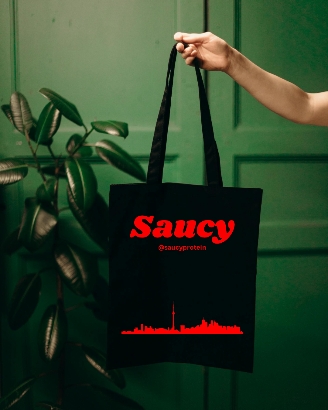 Saucy Red Logo on Black Tote Bag Canvas Bag @saucyprotein on socials Toronto skyline